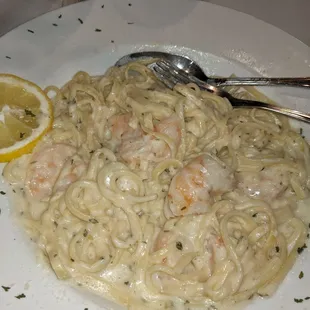 Shrimp with sauce and pasta.  Delicious, but I don&apos;t remember the name of it.