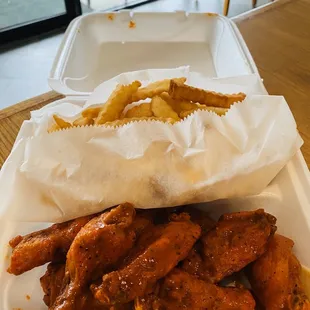 chicken wings in a styrofoam container