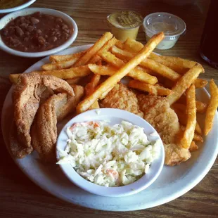 a plate of fish and chips and coleslaw