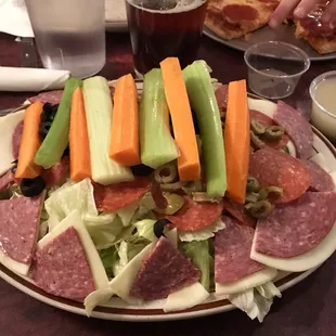 Most of my salads are eaten out of a styrofoam "take out" container...this is the antipasto salad offered up on a real plate.