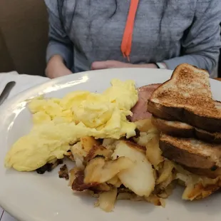 Scrambled eggs, potato and toast