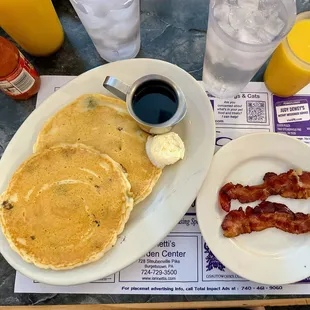 Gramma&apos;s cakes (pancakes with blueberries added), bacon, orange juices, waters