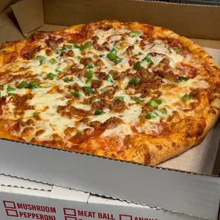 Sausage and green pepper pizza, all pizza dough is made fresh daily