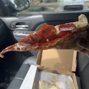 a slice of pepperoni pizza