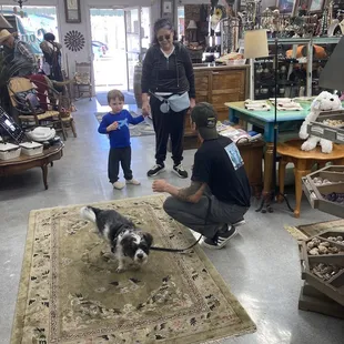 Clerk holding my dog while I shop