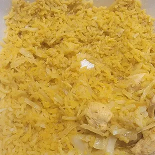 White rice drenched in the my yellow curry sauce