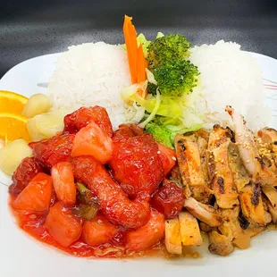 a plate of chicken, rice and vegetables