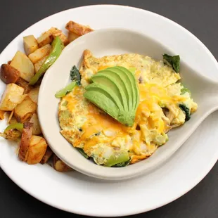 an omelet with potatoes and avocado