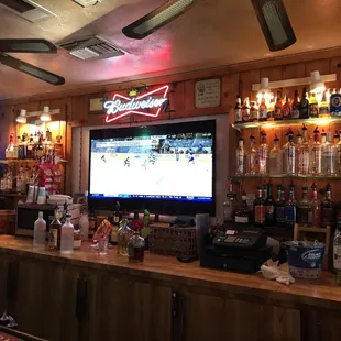 a bar with a large television