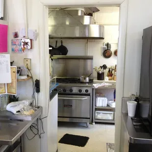 The kitchen through the doorway, where the cooking from scratch takes place
