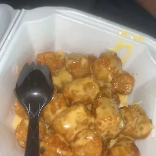 Cheese tots with their cheese sauce!