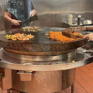 a man preparing food in a restaurant kitchen