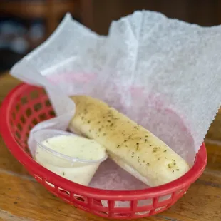 Breadstick and Alfredo sauce