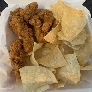 Chicken fingers with chips.