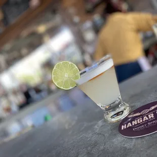 a margarita with a lime wedge