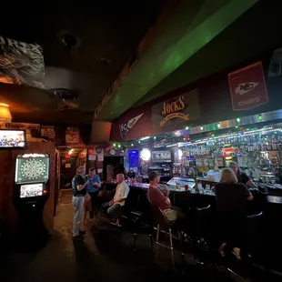a group of people sitting at a bar