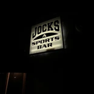 a neon sign in the dark