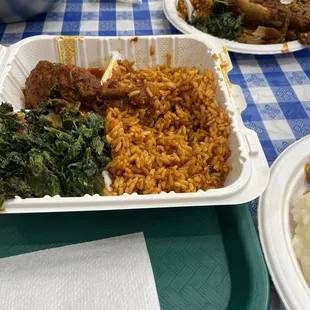 Halfway thru our Jollof Rice with Spinach and Stewed Chicken Platter