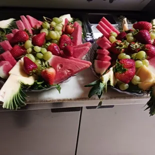 Cut up fruit at each table for bridal shower.  Magnificent presentation