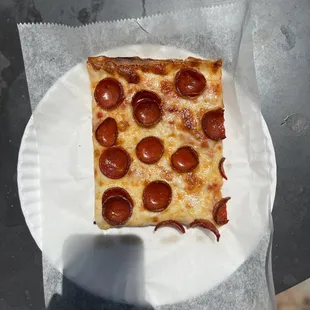 a slice of pepperoni pizza