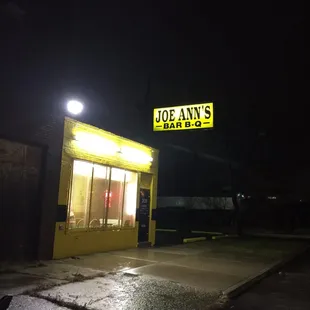 Storefront on a rainy night.