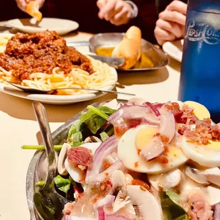 a plate of salad with hard boiled eggs