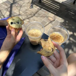a person eating a muffin