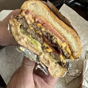 Double burger with bacon and extra pickle.