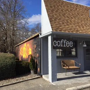 a bench outside of a coffee shop
