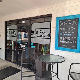 Outdoor seating under roof at the entrance