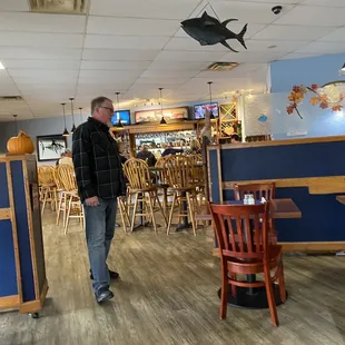 a man standing in a restaurant