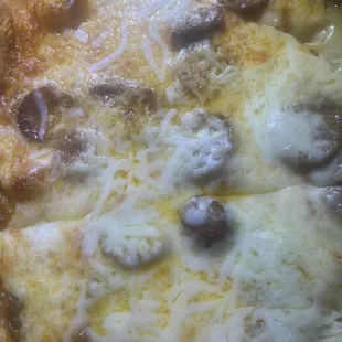 Cheese is obviously not melted together. This has been reheated and not fresh