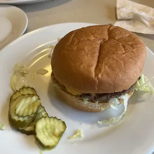 a hamburger and pickles