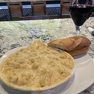 a plate of food and a glass of wine