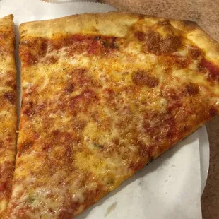 High school cafeteria level pizza. Left over, stiff crust, dark over cooked cheese. And undersized