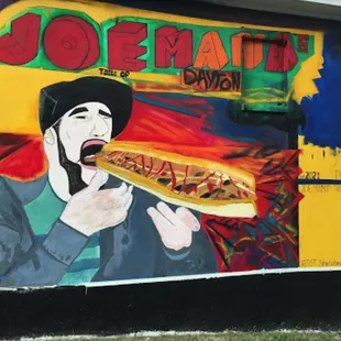 a man eating a hot dog