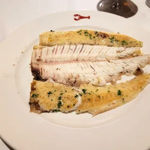 DoverSole a la Meuniere with Herbs de Provence, lemon, and brown butter plus stewed tomatoes.