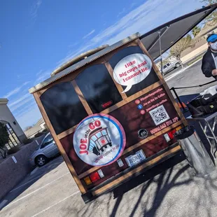 a man standing next to a coffee truck