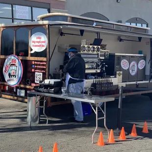 a man standing in front of a coffee truck