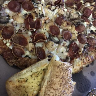 Always perfect! I asked for pepperoni on top because I like them crispy. Garlic bread has toasted sesame seeds.