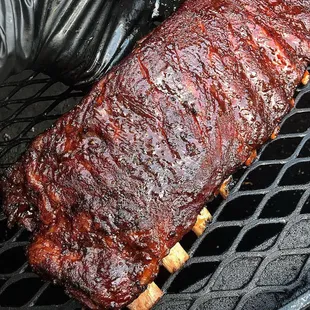 a rack of ribs on a grill