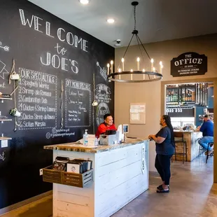 a blackboard wall with chalk writing