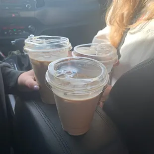 two cups of coffee in a car