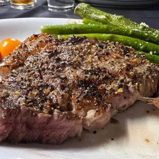 The 8oz Delmonico steak, cooked perfectly medium rare with Parmesan asparagus