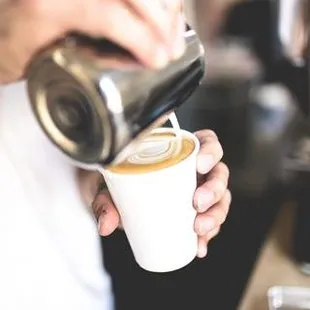 a bari pouring a cup of coffee