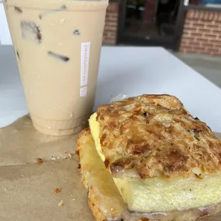 Coconut latte with a breakfast sandwich (ham and cheddar biscuit, scrambled egg and white cheddar cheese)