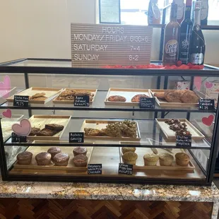 a display case filled with pastries