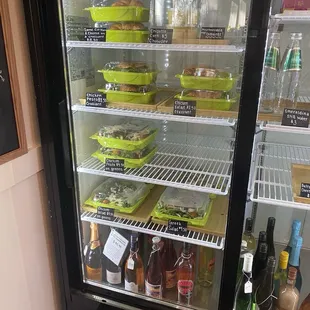 a refrigerated display case filled with drinks