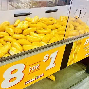 a display of yellow peppers