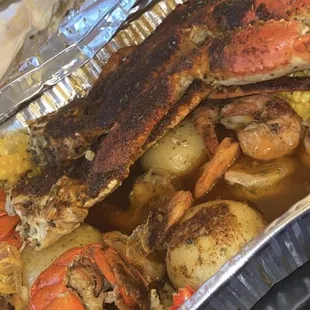 Pookie Man 1 pound of crab  1 pound of shrimp  2 4-5 oz lobster tails  Corn and potatoes!